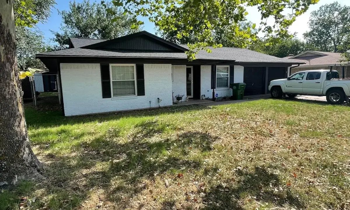 Professional roofing crew working on a residential roof in Abingdon